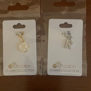R Charms. One with gold the other silver. NWT